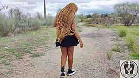Ebony chick with big ass walks in sneakers, flashing her tits