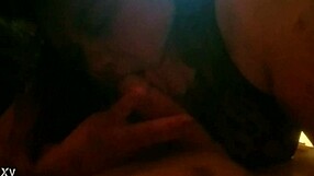 In this intimate scene, she eagerly sucks his cock with passion, taking it deep into her mouth while he watches closely.