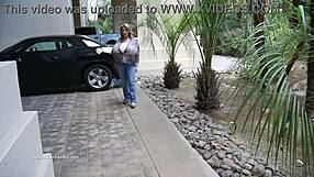 Chelsea Charms pops one button, revealing massive fake tits for the camera.