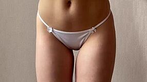 watch this innocent girl strip out of her stockings and lingerie for you