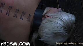 Bounded chick endures shocking prod on tits and hairless vagina in bdsm play