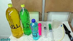 asian wife demonstrates extreme cervix stretching with bottles in homemade video