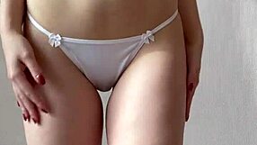 watch this innocent girl strip out of her stockings and lingerie for you