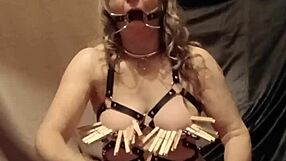 Slave woman self-pleasures in leather harness