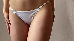 watch this innocent girl strip out of her stockings and lingerie for you