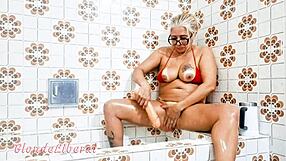 Is She Inserting Dildo In Pussy Or Just Flashing In Bathroom?