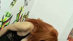 I watch the hot red milf suck a monster cock at the gloryhole