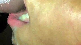 Sloppy ebony redhead receives wet cumshot on her black hood.