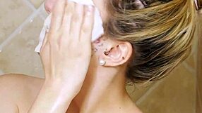 Gorgeous blonde enjoys a relaxing shower on the sofa