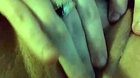 she plays with her wet pussy, fingering herself while watching friends' porno