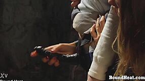 Bent over lesbian slave takes strapon deep