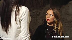 Bent over lesbian slave takes strapon deep