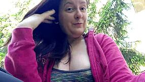 Nicoletta smokes in a public garden and shows you her big tits by pulling them out of her shirt