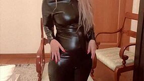 Oiled belly dancer in latex catsuit performs domination dance to music by findom goaldigger