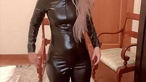 Oiled belly dancer in latex catsuit performs domination dance to music by findom goaldigger
