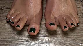 Close up of my oiled latina toes with green nails for your fetish pleasure