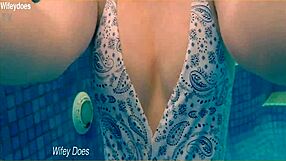 Preview of wife swimming in hotel pool wearing hot one piece swimsuit