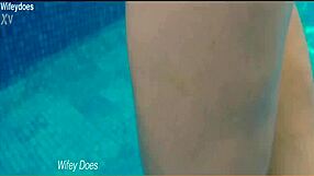 Preview of wife swimming in hotel pool wearing hot one piece swimsuit