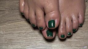 Close up of my oiled latina toes with green nails for your fetish pleasure