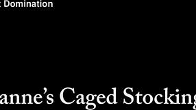 Roxanne's caged slave teases with stocking feet in femdom play