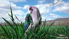 goddess feet in cute white socks with jeans on the spring grass field