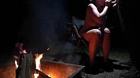 Naked couple sucking cock in forest during camping?