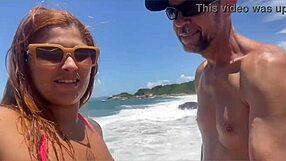 I sucked a huge cock on the beach while everyone watched us.