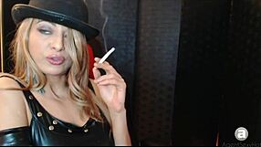 In the smoking humiliation scene, she endures fetish play with boots and ass