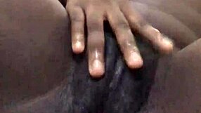 Ebony amateur masturbates her wet pussy solo