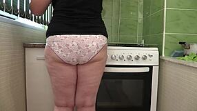 Home camera captures curvy mature milf cleaning in panties, showcasing big ass backstage
