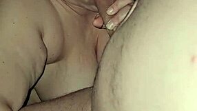 Look at this milf with big tits sucking that huge cock!