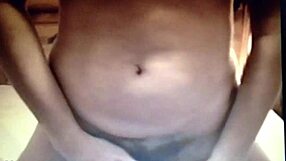 Brunette amateur masturbates on bed