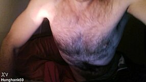 Athletic bodybuilder spits during double cock action