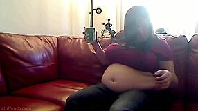 Azmiss stuffs ice cream into her big tits and ass