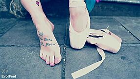 Ballerina wears ballet shoes while walking down the street