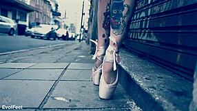 Ballerina wears ballet shoes while walking down the street