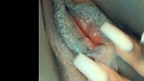 She feels so horny rubbing her pussy while thinking of that big cock.