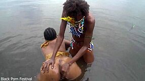 two lesbians bathe together in village river