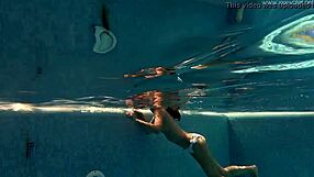Irina Russaka Bathes Underwater In Public Pool