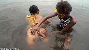 two lesbians bathe together in village river