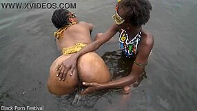 two lesbians bathe together in village river