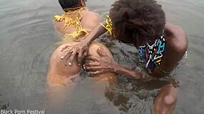 two lesbians bathe together in village river