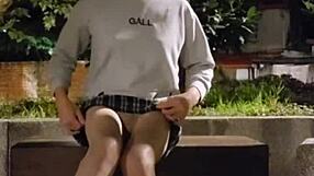 Shemale ting xuan pees outdoors and removes underwear for masturbation in the park