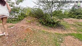 Thai girl takes a relaxing walk in the forest