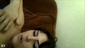 Sexy innocent brunette masturbates by fingering herself in someone else's house