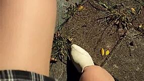 Shemale ting xuan pees outdoors and removes underwear for masturbation in the park