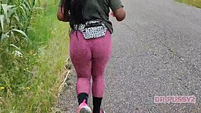 I'm watching this ebony pornstar with a big tattooed ass running in leggings in the forest.