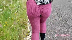 I'm watching this ebony pornstar with a big tattooed ass running in leggings in the forest.