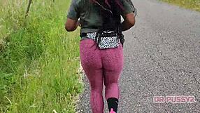 I'm watching this ebony pornstar with a big tattooed ass running in leggings in the forest.