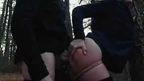 Two perverts crawl with bubble butt milf in forest.